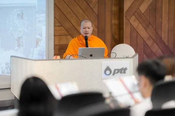 Speaking to the room from the PTT lectern