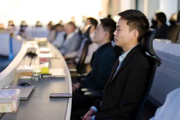 A row of participants in meditation
