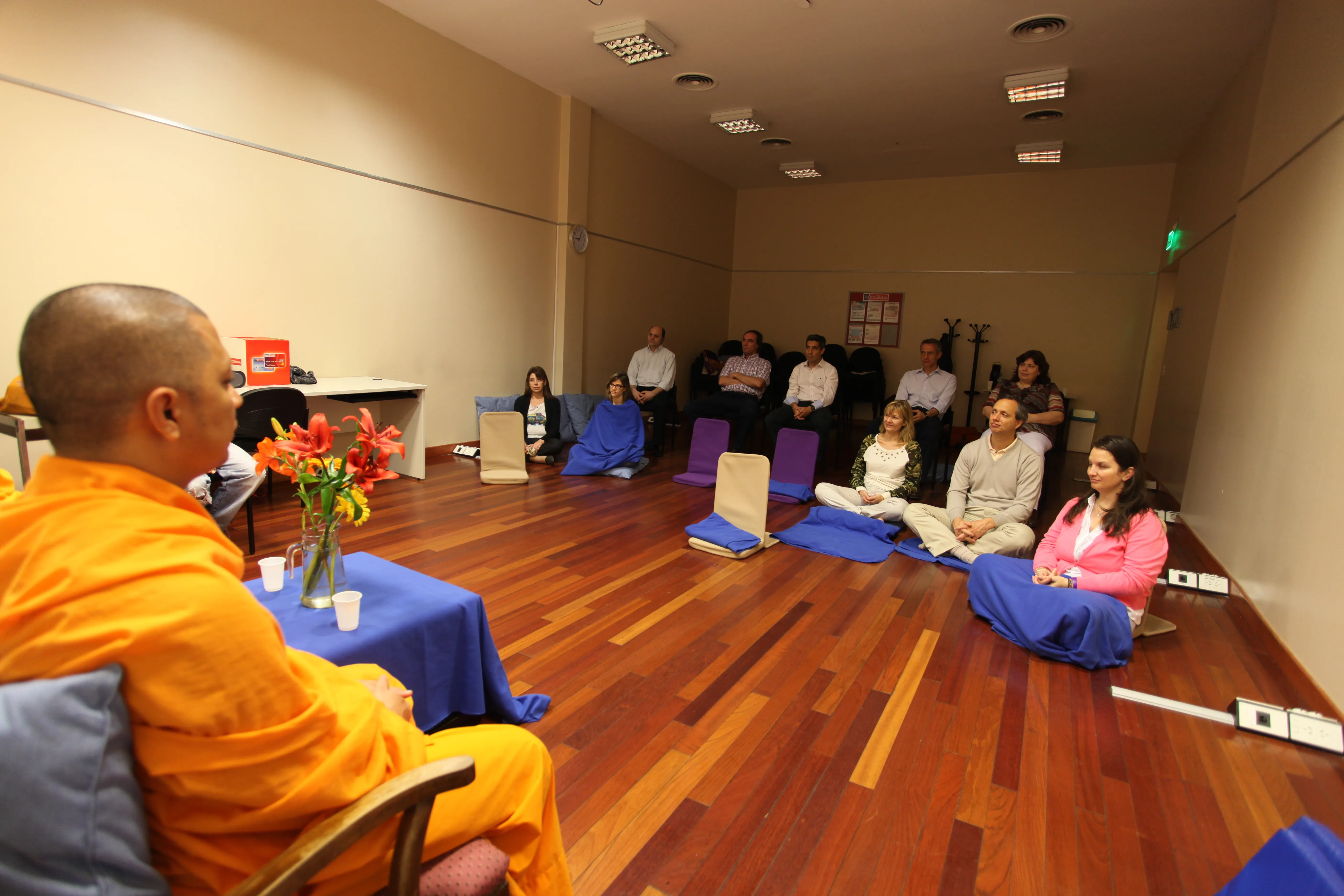 Meditating with employees in a small room at Banco Columbia